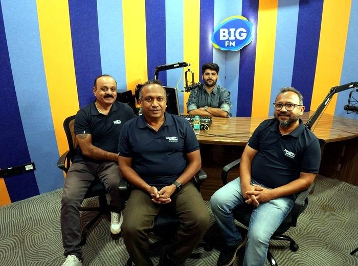 Team at a radio station studio for a press interview