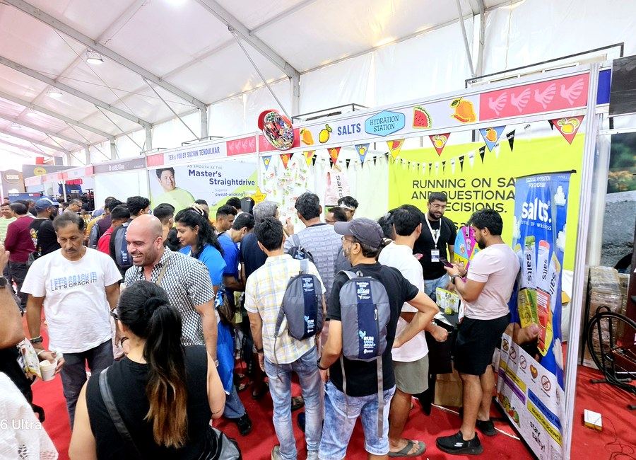 Crowd gathered at a sponsor hydration booth in the race expo, part of Abunduntia's sponsorship programme delivery